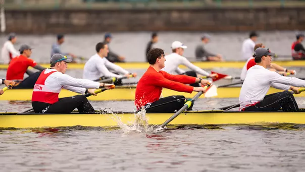 Photo of multiple BU Men's Rowing crews racing on the Charles River.