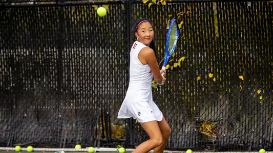 Madison Liu winds up to hit a backhand on the tennis court