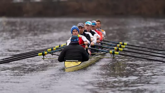Photo of the BU Men's Rowing Second Varsity 8 practicing on the Charles River.