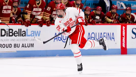 Aiden Celebrini shooting the puck