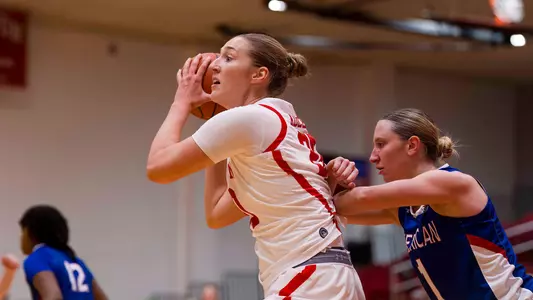 Photo of BU women's basketball senior Anete Adler holding the ball at Case Gym.
