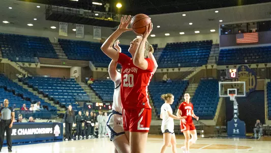 Photo of BU women's basketball senior Anete Adler shooting a layup at Navy.