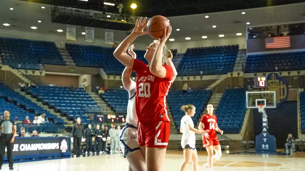 Photo of BU women's basketball senior Anete Adler shooting a layup at Navy.