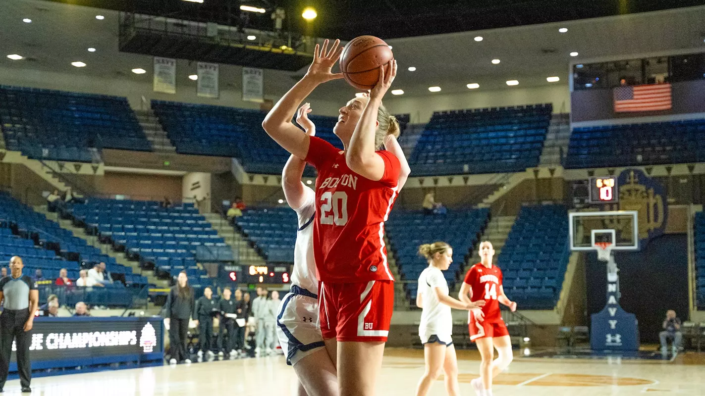 Photo of BU women's basketball senior Anete Adler shooting a layup at Navy.