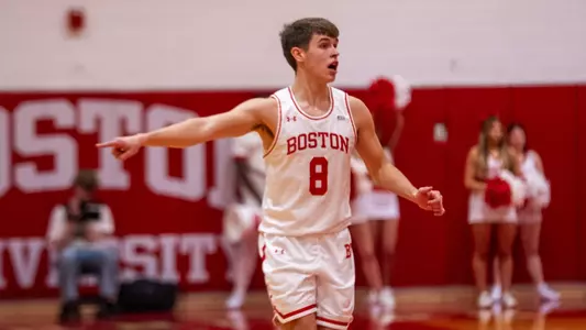 Peter Carr points to his left trying to help match up teammates defensively against the opposing players