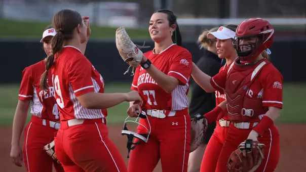 Kasey Ricard celebrates with teammates after a win at Harvard