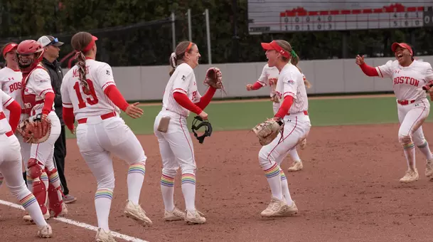 Haley Ganino is greeted by teammates after turning a double play