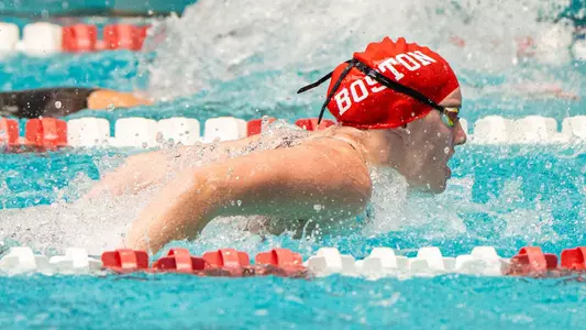 Ava Coombs swims butterfly vs. Bryant