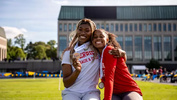 Peace Omonzane and Jada Smith with Medals