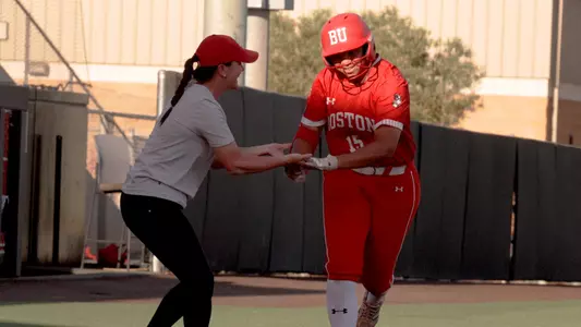 Irys Kline celebrates with head coach Ashley Waters after hitting a pinch-hit home run in the NCAA Lubbock Regional against Marist