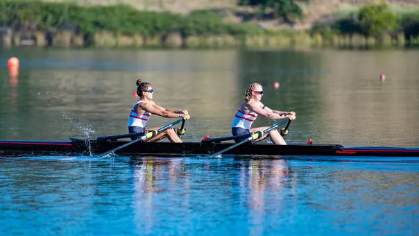 Photo of the BU Lightweight Rowing Double racing at the IRA National Championship Regatta.