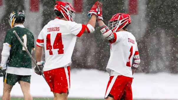 Connor Kehm and Timothy Shannehan high five during a game against Siena