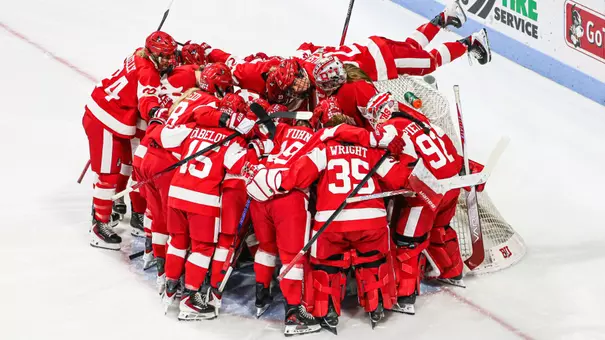 Women's ice hockey pre game huddle at the net