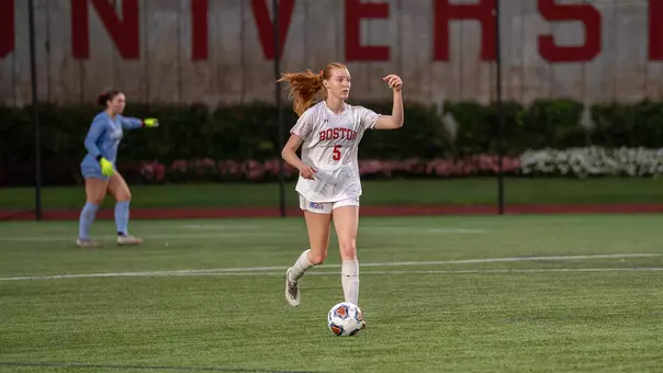 Photo of BU women's soccer senior Ciara Kennedy dribbling the ball.