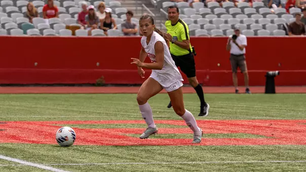 Photo of BU women's soccer freshman Sam Ryan dribbling the ball at Nickerson Field.