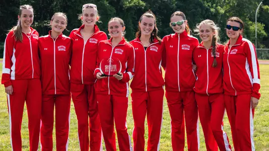 BU women's cross country team poses with trophy after winning 2026 UMass Dartmouth Invitational