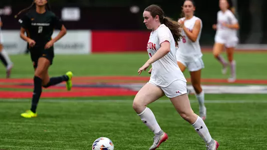 Photo of women's soccer sophomore Georgia Prouty dribbling the ball at Nickerson Field.