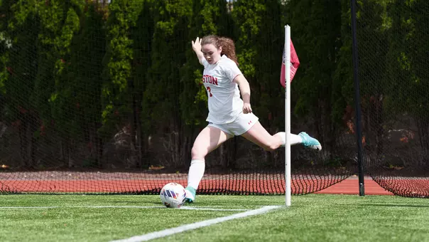 Photo of BU women's soccer sophomore Georgia Prouty inserting a corner kick.