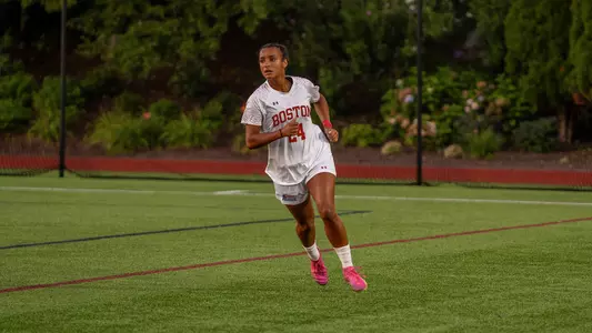 Photo of BU women's soccer sophomore Ariana Schwinn-Clanton running on Nickerson Field.