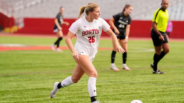 Photo of BU women's soccer sophomore Averie Hoff dribbling the ball at Nickerson Field.