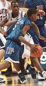 Courtney Trask drives past Saint Louis' Marque Perry in the first half Saturday.