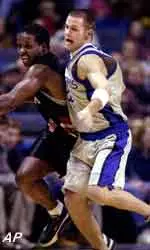 Memphis' Nathaniel Root battles for a loose ball during Monday's 98-54 win over Christian Brothers at the Pyramid in Memphis.