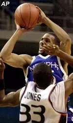 Memphis' Shyrone Chatman shoots over Miami's James Jones during the first half Thursday.