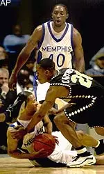 Shyron Chatman, who added 16 points for the Tigers, scraps for a loose ball at the Pyramid Wednesday night.