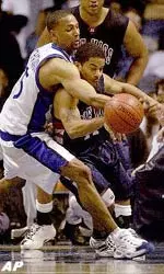 Memphis guard Shyrone Chatman jars the ball loose from an Ole Miss player.