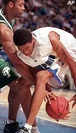 Kelly Wise battles with Tulane's Ledaryl Billingsley for a loose ball during the first half of Wednesday's game.