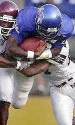 Memphis quarterback Travis Anglin tries to break through the Mississippi State defense.