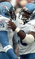 Sugar Sanders celebrates with teammate Darche Epting after Sanders scored Memphis' first touchdown.