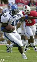 Dante Brown sets a school record with four touchdowns versus the Cougars.