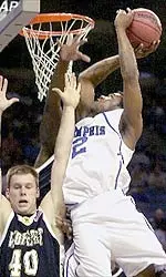 Dajuan Wagner drives to the basket over Wofford's Grant Sterley in the first half of the Guardians Classic.
