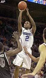 Dajuan Wagner shoots over Eastern Kentucky defenders.  Wagner finished with 26 points in the victory.