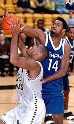 Memphis forward Paris London knocks the ball out of the hands of Southern Mississippi guard Vandarel Jones as Jones attempts a layup during the first half in Hattiesburg, Miss., Wednesday