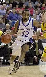 Memphis' Marcus Moody drives past the defense of Marquette's Brian Barone during their Conference USA tournament second-round game Thursday.