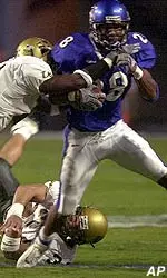 Darron White escapes the grasp of a South Florida defender.