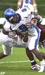 Ryan Johnson returns a punt return during the second quarter.