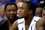 Milt Wagner, an administrative assistant for Memphis, left, watches his son, Memphis' Dajuan Wagner, from the bench Saturday.