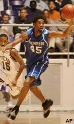 Forward Kelly Wise hauls in a loose ball against Texas Christian's Alan Blount during the first half Wednesday night.