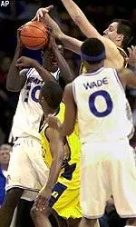 Memphis center Earl Barron gets pressured by Murray State's Mark Borders and Andi Hornig in the first half.
