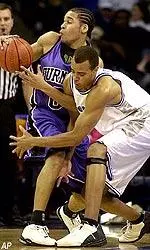 Forward Duane Erwin goes for a steal during the first half against Furman.