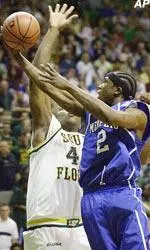 Guard Dajuan Wagner tries to get his first-half layup around South Florida's Mike Bernard.