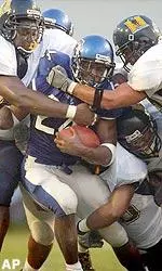 Dante Brown fights for extra yards.