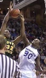 Memphis' Earl Barron (30) blocks a shot by South Florida's Yasuf Baker (32) during the first half.