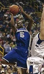 Memphis' Jeremy Hunt shoots over Saint Louis' Drew Diener in the second half.