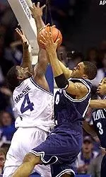 Chris Massie tries to block a shot by Villanova's Allan Ray during the first half.