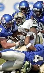 UAB's Trey Chaney is stopped by Memphis defenders.