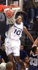 Rodney Carney dunks the ball over Samford's Tyson Dorsey (33) during the first half on Monday in Memphis.